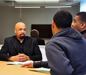 Chris Coleman talking with students